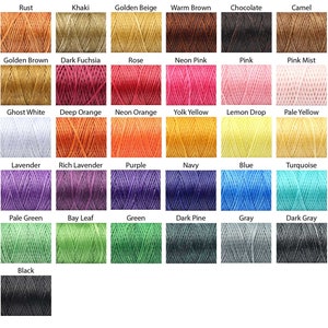 May include: A colour chart showcasing a range of threads. The chart includes shades such as rust, khaki, golden beige, warm brown, chocolate, and camel. Other colours include pink, blue, green, and black.