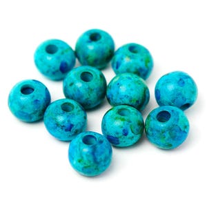 May include: A cluster of turquoise beads with a speckled design. Each bead is spherical with a hole through the middle. The beads have a marbled look with shades of blue and green.