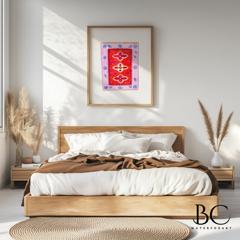 May include: A framed watercolor painting of a red and pink rug with a floral design. The painting is hanging on a white wall above a bed with brown bedding.