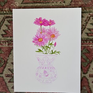 May include: A watercolor painting of a bouquet of pink flowers in a pink and white patterned vase.