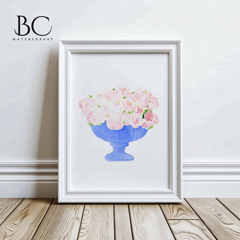 May include: A watercolour painting of a bouquet of pink flowers in a blue vase. The vase has a scalloped rim and a pedestal base. The flowers are arranged in a loose, natural style.