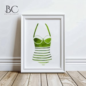 May include: A framed print of a green and white striped swimsuit. The swimsuit is a vintage style with a halter top and a high waist.