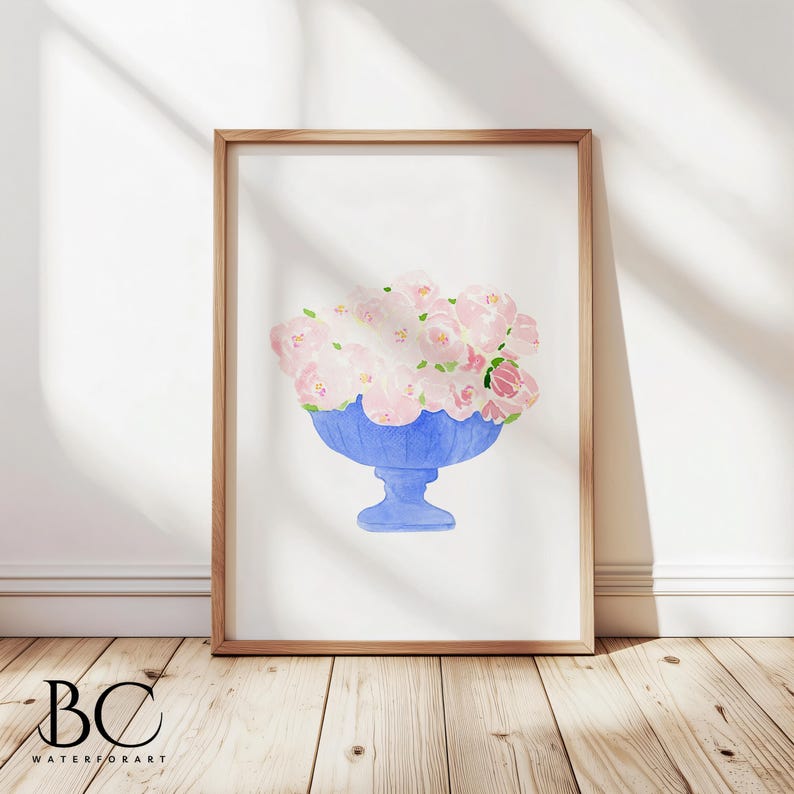 May include: A watercolour painting of a blue vase filled with pink flowers. The vase has a pedestal base and is painted in a light blue colour. The flowers are pink and white and are arranged in a loose, natural style.