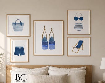 May include: A gallery wall set of five framed watercolour prints featuring nautical themes including a blue striped tote bag, blue swim trunks, two blue buoys with rope, a blue bikini, and a blue beach chair, all displayed in light wood frames.