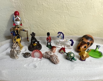 Psychotherapy sand tray miniature set combines both frightening and whimsical imagery from childhood