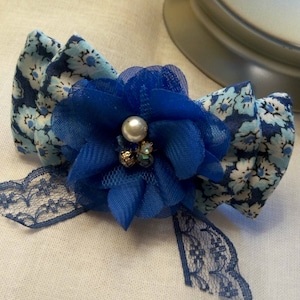 Brooch: silver, it is topped with bowties in liberty fabric