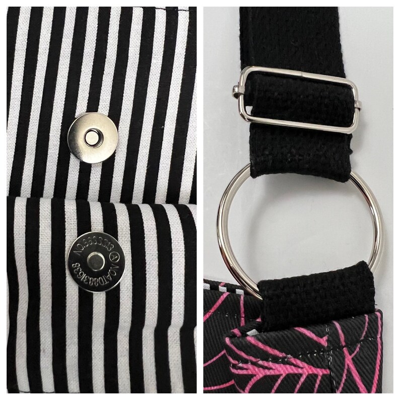 K&ouml;nnte beinhalten: Eine schwarze und wei&szlig;e gestreifte Stofftasche mit einem schwarzen Riemen und silbernen Beschl&auml;gen. Die Tasche hat zwei silberne Druckkn&ouml;pfe und ein schwarzes Stofffutter.