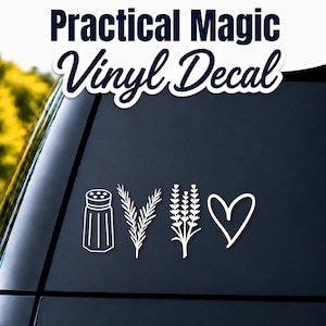 Op de afbeelding: Een witte vinylsticker met vier afzonderlijke iconen: een zoutvaatje, een takje rozemarijn, een stengel lavendel en een handgetekend hart. De tekst "Practical Magic Vinyl Decal" staat bovenaan en "Blue82 DESIGNS" onderaan.