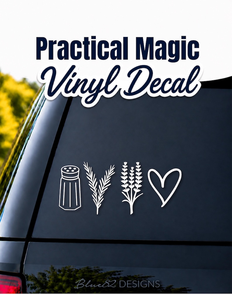 Op de afbeelding: Een witte vinylsticker met vier afzonderlijke iconen: een zoutvaatje, een takje rozemarijn, een stengel lavendel en een handgetekend hart. De tekst "Practical Magic Vinyl Decal" staat bovenaan en "Blue82 DESIGNS" onderaan.