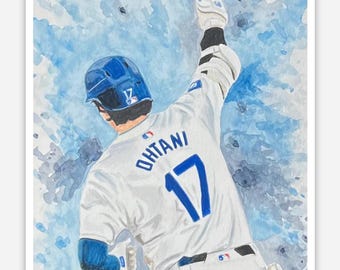 Op de afbeelding: Waterverfsticker met een honkballer in een wit uniform met nummer 17 en de naam "Ohtani" op de rug. De speler viert met zijn arm omhoog tegen een blauwe waterverfachtergrond.