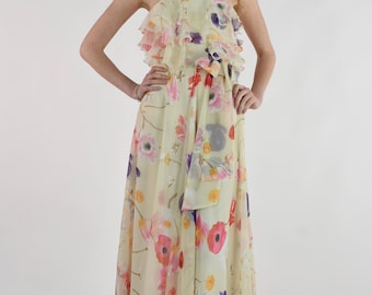 Jaren 70 maxi-zomerjurk met bloemenprint en ruches op het lijfje