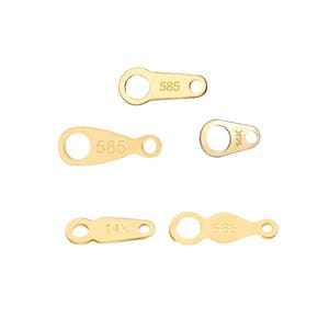 May include: Five gold-colored metal jump rings with different markings. The rings are marked with "585" and "14K".