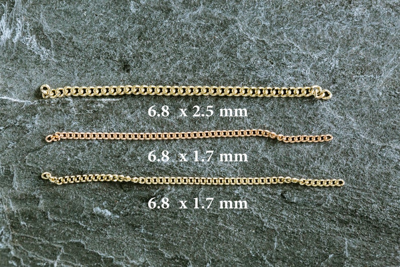 May include: Three gold chains of different sizes laid out on a gray textured surface. The chains are 6.8 mm wide and 2.5 mm, 1.7 mm, and 1.7 mm thick.