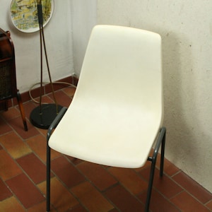 vintage white molded plastic stacking chair by Kusch + Co