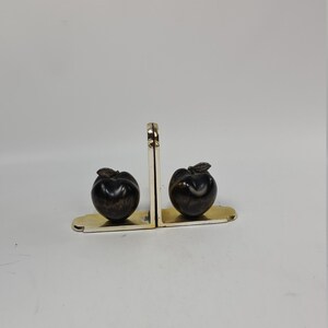 A pair of vintage metal and wood bookends