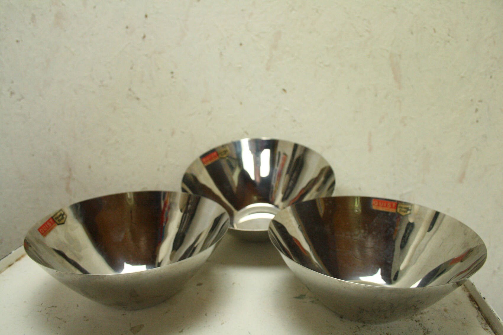 Three vintage stainless steel bowls by Quist