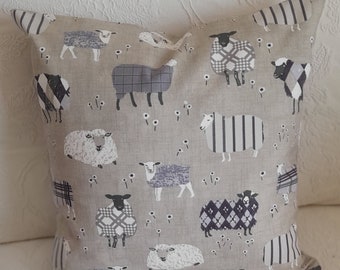 Mauve sheep cushion cover / pillow cover /cushion sham  in organic cotton.  Comedy sheep design on both sides and fits an 18" square pad.