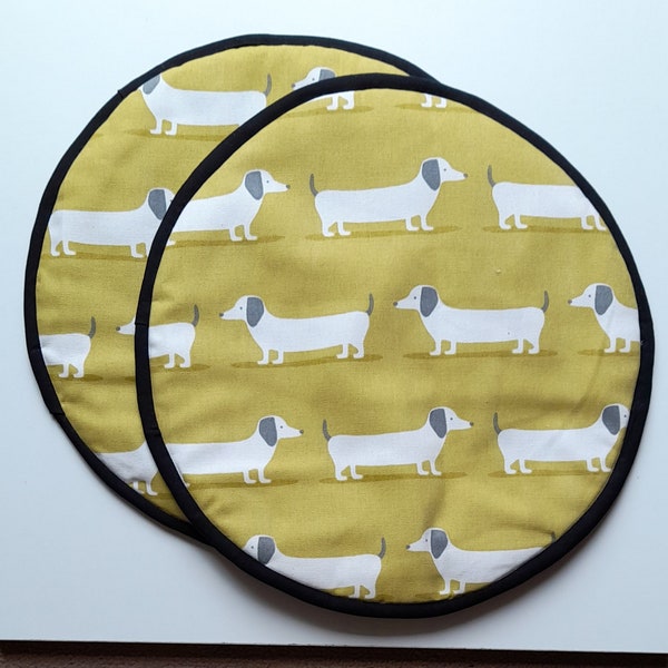 Set of 2 Hob covers / aga covers /chefs pads in yellow dachshund design organic cotton with heat resistant padding & black cotton backing.