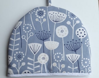 Tea cosy / teapot cover in organic cotton, in a blue bergen designs, padded & lined in white cotton and trimmed in white..
