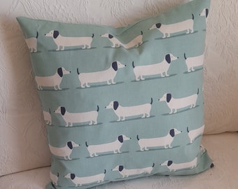 Blue dachshund design cushion cover / pillow cover  in organic cotton.  Blue dachshund design on both sides and fits an 18" square pad..