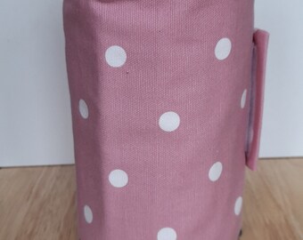 An attractive cotton cafetiere cover / coffee pot cover in  pink dotty design.  Padded to enable your coffee to stay hot for longer..