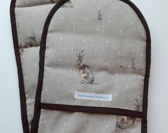 Hartley hare design Double oven gloves  in thick padded cotton trimmed in brown binding.