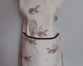 Adult apron in a Otter design with front patch pocket.