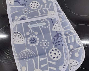 A stylish padded double handed oven glove /oven mitt /pot holder in thick cotton fabric in blue and white Bergen design..