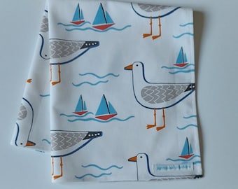 Organic cotton tea towel in Whitby Seagull design in white.