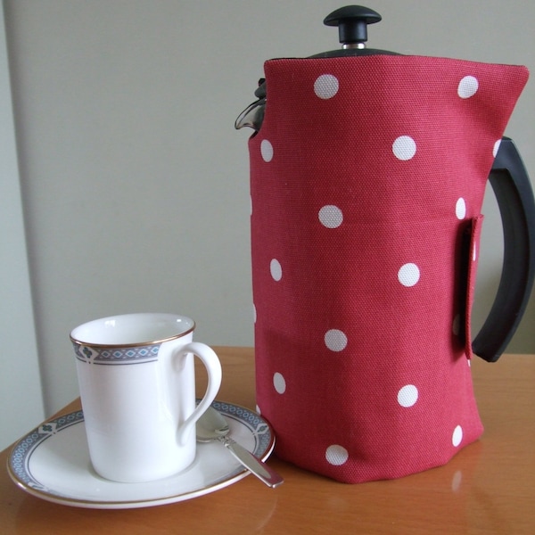 A stylish cafetiere cover / coffee pot cover in slightly padded organic cotton in a red dotty design