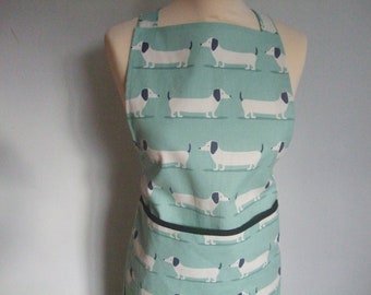 Dachshund dog / sausage dog  design Adult apron in duck egg blue thick cotton with front patch pocket trimmed in black binding.
