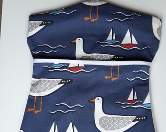 Attractive thick cotton peg bag/ clothes pin bag in a design of white seagulls on a navy blue background.