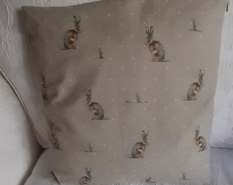 Cushion cover / pillow slip / pillow sham in a  country design of hares on a beige background. Concealed zip fastening.