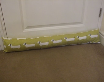 Dachshund dog draught excluder to fit average size door in yellow ochre thick cotton filled polyester wadding and wheat for extra weight.