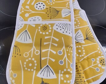 A stylish padded double handed oven glove /oven mitt /pot holder in thick cotton fabric in yellow ochre and white Bergen design..