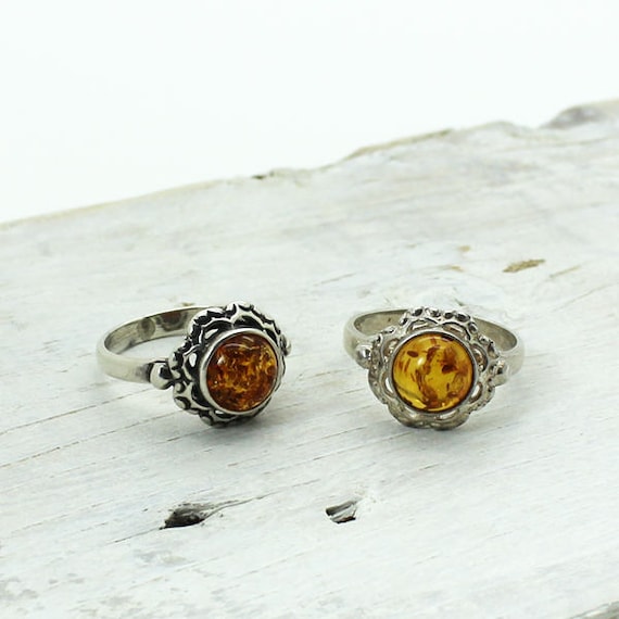 Delicate Antique Amber flower ring with silver orn