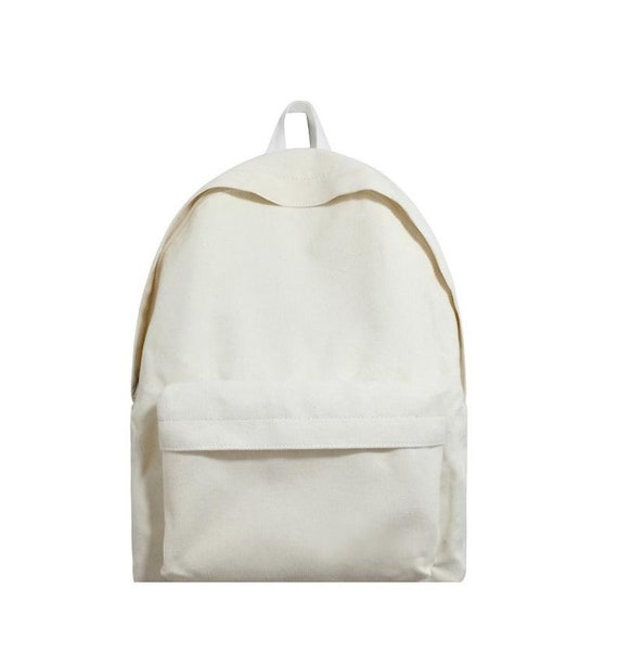 white corduroy backpack