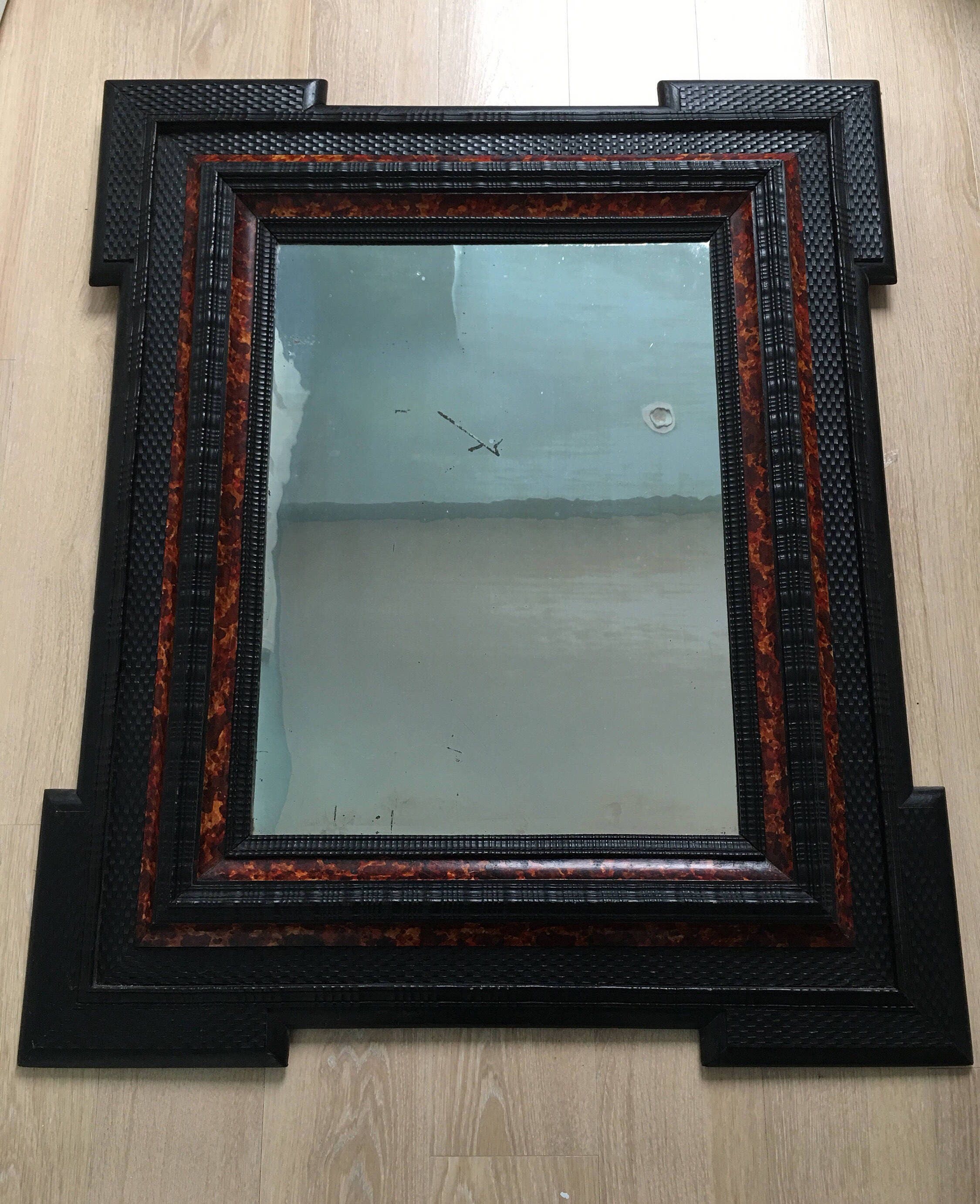Late 19th century ebonised Dutch ripple frame faux tortoise shell mirror
