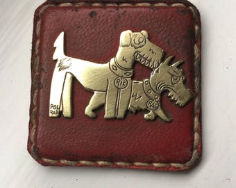Ric et Rac brass and red leather badges Pol Rab French cartoon dogs circa 1920's