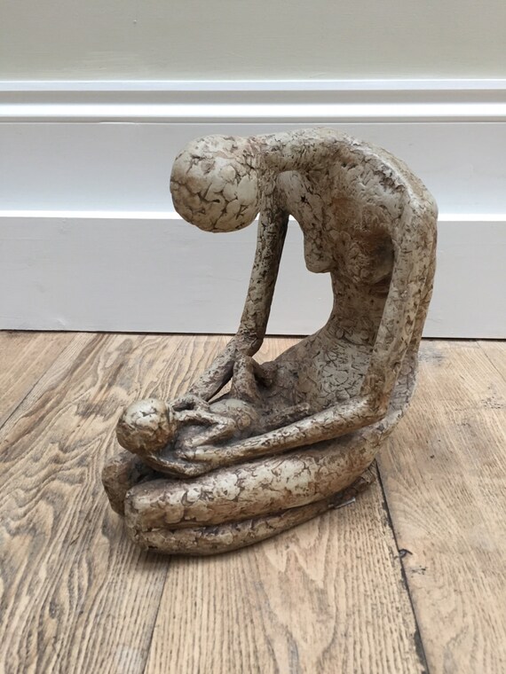 A mother and child sculpture in resin fibreglass by the artist Joy Stewart circa 1980's