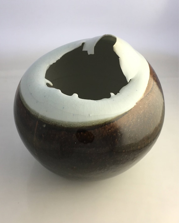 Vintage Porcelain ovoid collapsed form with tenmoku glaze