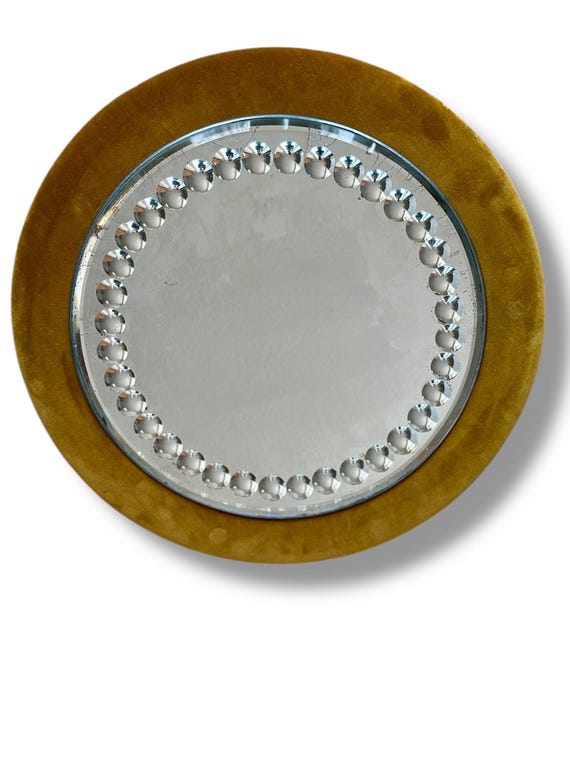 Circular English Sorcerers mirror with rust colour velvet frame circa 1900