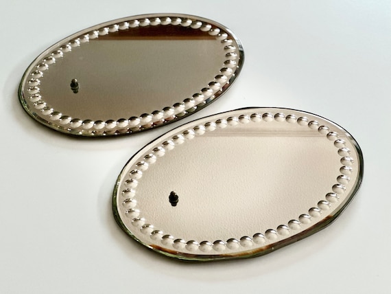 Pair of English 19th century oval Sorcerers mirrors