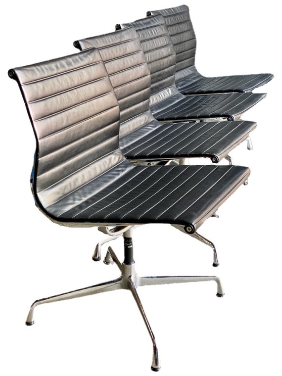 Eames Vitra EA 105 Alu group side chairs in chrome and black leather circa 1980’s