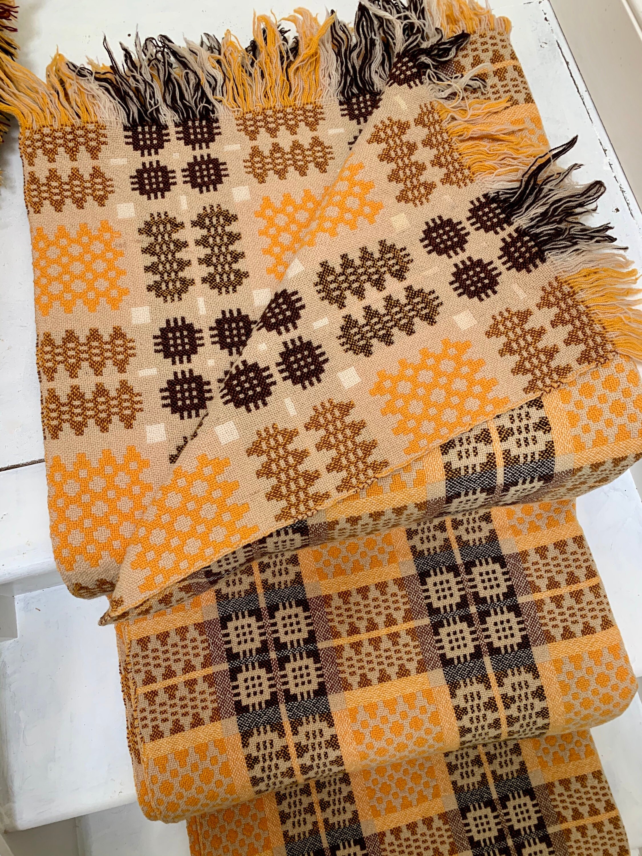 Vintage Welsh tapestry blanket in yellows, browns and creams.