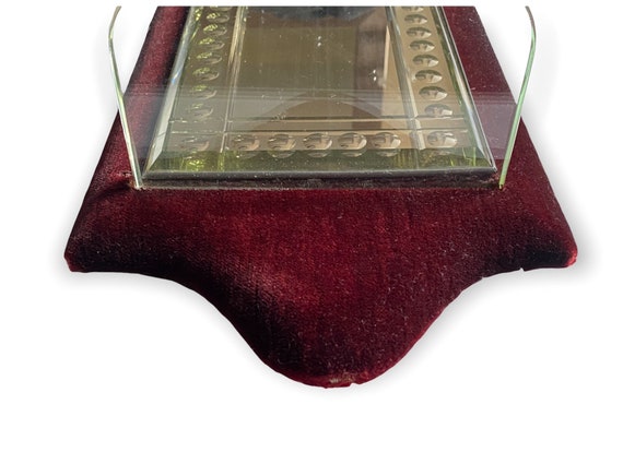 Late Victorian sorcerers mirror with glass shelf in red velvet frame
