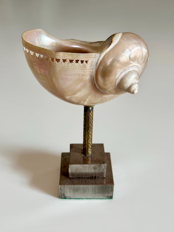 vintage engraved Conch shell on aluminium stand