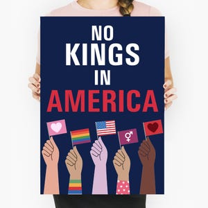 May include: A navy blue poster with the text "NO KINGS IN AMERICA" in white and red. The poster features diverse hands holding flags with various symbols, including a heart, rainbow, American flag, gender symbol, and another heart.