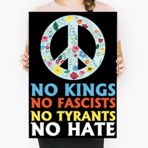 May include: A black poster with a peace symbol filled with colorful flowers and leaves. The text "NO KINGS, NO FASCISTS, NO TYRANTS, NO HATE" is displayed in bold, colorful letters. The poster is held by a person.