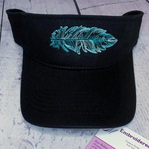 May include: A set of three ceramic mugs with a speckled, matte finish. The mugs are in shades of cream, light gray, and dark gray. Each mug has a simple, minimalist design, perfect for coffee or tea.